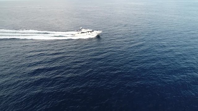 Motorboat on the sea, aerial view with a drone, funny day