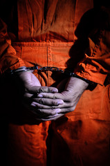 The prisoners were handcuffed behind his back