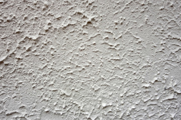 White washed stucco wall with very heavy texture