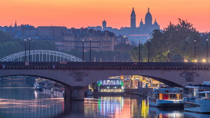 Fototapeta na wymiar Basilica Sacre Coeur and the Seine river night to day transition timelapse before sunrise, Paris, France.