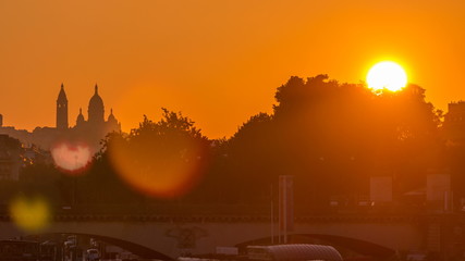 Sunrise with Basilica Sacre Coeur and the Seine river timelapse, Paris, France.