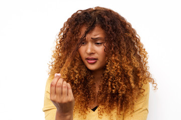 unhappy young woman with hair problems