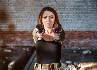 portrait of cute girl with two guns