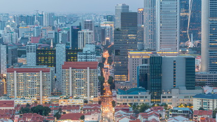 Aerial view of Chinatown and Downotwn of Singapore day to night timelapse