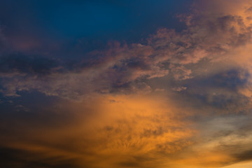 Beautiful twilight sky with orange and blue colour dramatic cloud.
