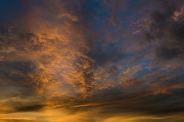 Naklejka na ściany i meble Beautiful twilight sky with orange and blue colour dramatic cloud.