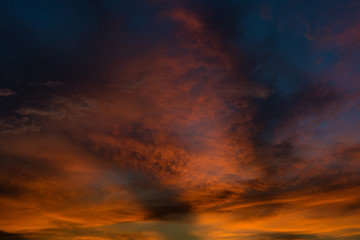 Beautiful twilight sky with orange and blue colour dramatic cloud.