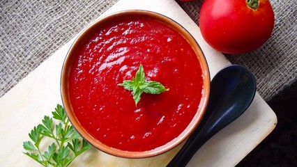 Delicious tomato cream soup on the table.