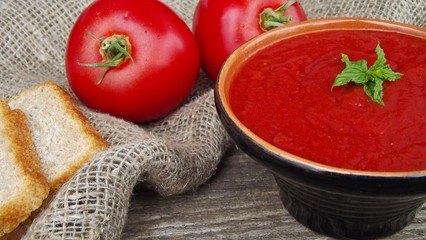 Delicious tomato cream soup on the table.