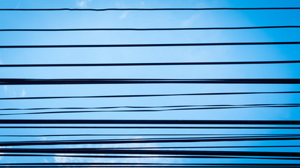 Wires and blue sky background