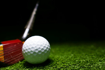Golf clubs and golf balls is on the Putting Green