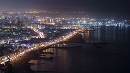 Fototapeta na wymiar Panoramic view of Sharjah coastline from Ajman rooftop timelapse - third largest and most populous city in United Arab Emirates
