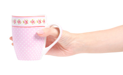 Cup mug vintage pink flower print in hand on white background isolation
