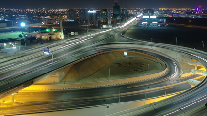 Fototapeta na wymiar Cityscape of Ajman from rooftop at night timelapse. Ajman is the capital of the emirate of Ajman in the United Arab Emirates.
