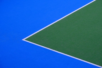 Sports field for hockey or football. Playground green and blue with white stripes