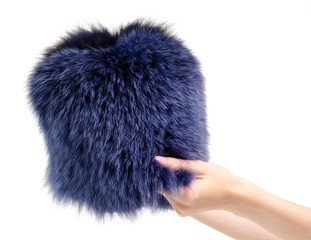 Fox fur hat in hand on white background isolation