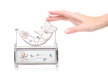 Casket for jewelry in female hand on white background isolation