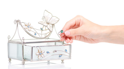 Casket for jewelry ring in female hand on white background isolation