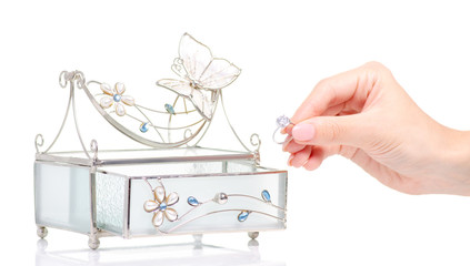 Casket for jewelry ring in female hand on white background isolation
