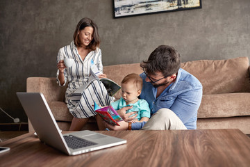 Family - Parent spending happy time at home with their baby son.