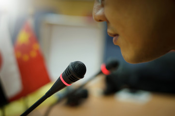 The politician was speaking at the microphone in the conference, the leaders of the major powers