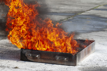 Close up flame on a tray. Fire training event