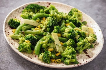 Cooked green vegetables as broccoli and green bean.