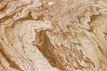 The plate is made of marble of brownish-white shades. Smooth texture for design and decoration. Natural building material. Natural patterns on the stone. Plates for floor and walls.