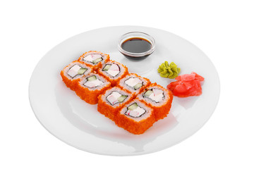 Sushi, rolls, uramaki, california, with tobiko caviar, avocado, cucumber, cheese, crab meat, raw seafood, soy sauce, marinated ginger and wasabi food on plate white isolated background Side view