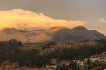 Vulcano in the background of the cityscape of otavalo, ecuador