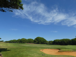 rake by sand bunker on a golg course in Portugal