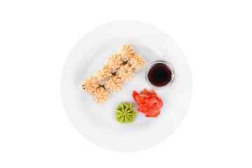 Sushi, rolls, uramaki Alaska, lava sauce, tobiko caviar, raw seafood, soy sauce, marinated ginger and wasabi, food on plate, white isolated background view from above For the menu, restaurant, cafe