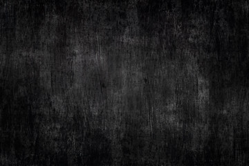 Obraz na płótnie Canvas a black painted metal background with brush strokes