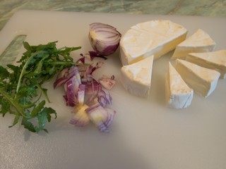 camembert cheese and red onion prepared for a salad