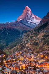 Fotobehang Zermatt. Image of iconic village of Zermatt, Switzerland with Matterhorn in the background during twilight. © rudi1976