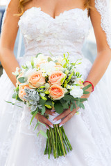 bride at a wedding with a bouquet of flowers