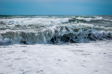 Waves breaking on a beach