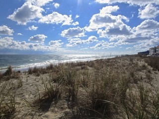 Bethany Beach, Delaware, USA: A long, low band of beautiful white clouds along the beach on the Atlantic Ocean.