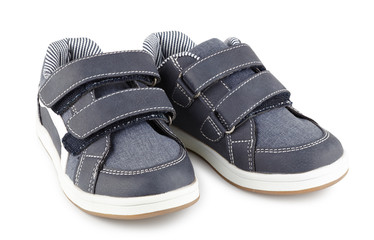 children's sports sneakers of gray color, boyish casual shoes isolated on white