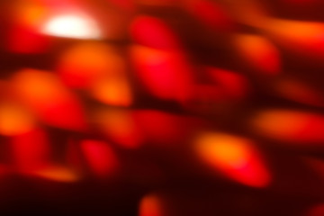 abstract lens flare on black background. red defocused lights. glowing blurred color burst. festive...