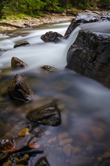Fototapeta na wymiar The waterfall on the long exposure in the Carpathian Mountain
