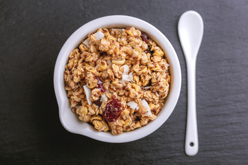 Bowl of homemade granola with nuts. Copy space
