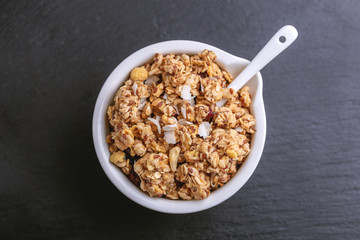 Bowl of homemade granola with nuts. Copy space