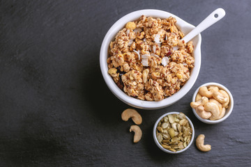 Bowl of homemade granola with nuts. Copy space