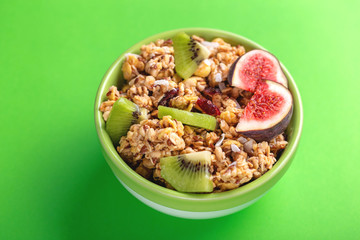 Bowl of homemade granola with fresh bananas and figs