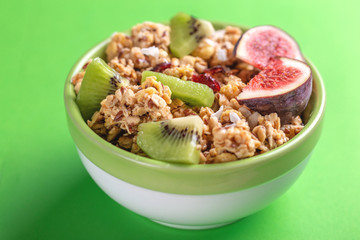 Bowl of homemade granola with fresh bananas and figs