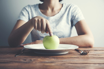 Female hand  plate with apple