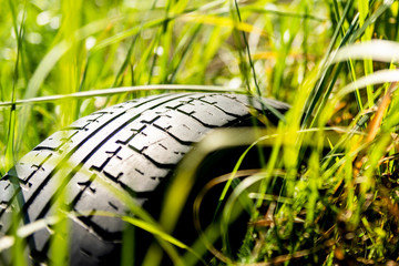 car tire in the grass