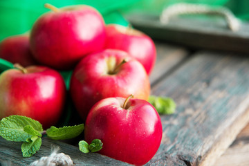 group of red apples on wooden natural background, fresh natural food and vitamins concept in rustic style