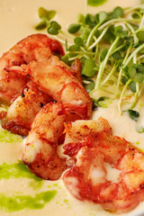 Creamy cheese soup with grilled shrimps